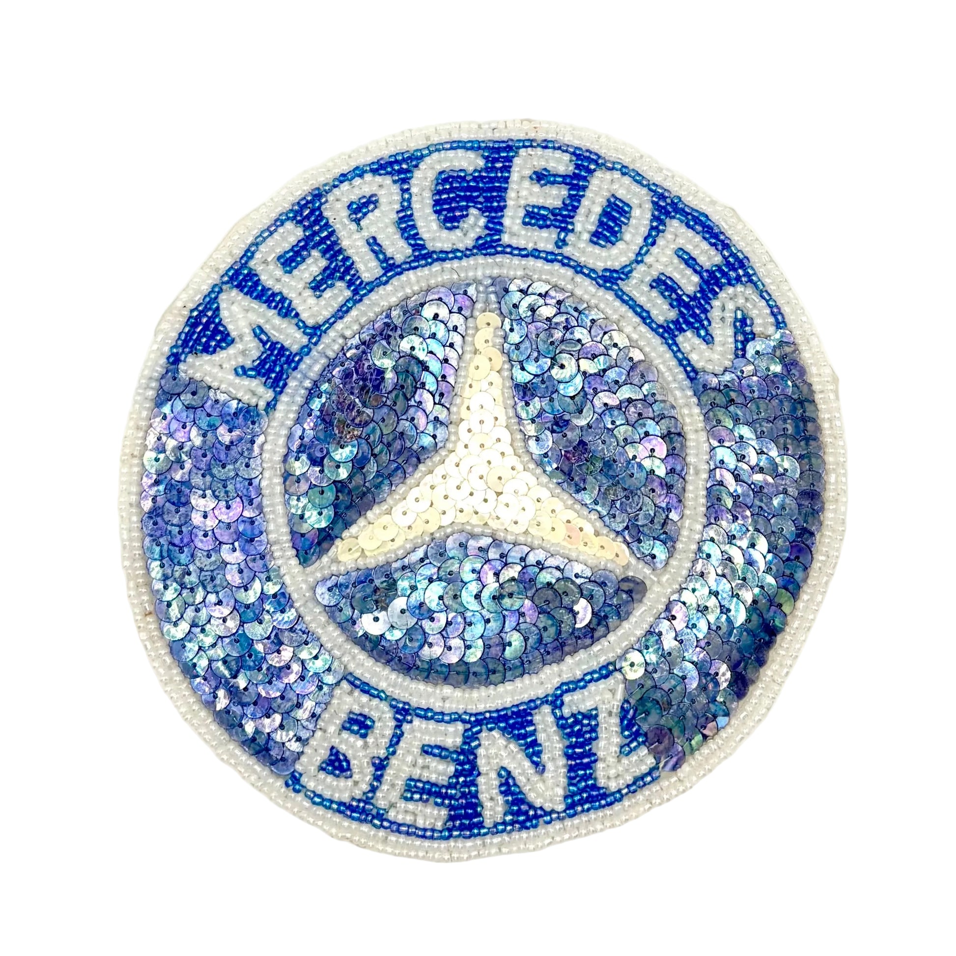 A vintage Mercedes-Benz embroidered patch featuring blue and silver sequins, white embroidered lettering, and the iconic three-pointed star logo in the center, set against a plain white background.