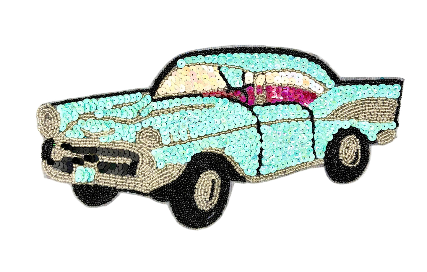 A vintage-style car patch or applique made from rhinestones, featuring a light aqua body, cream and pink interior details, black wheels, and a black outline, shown on a plain white background.