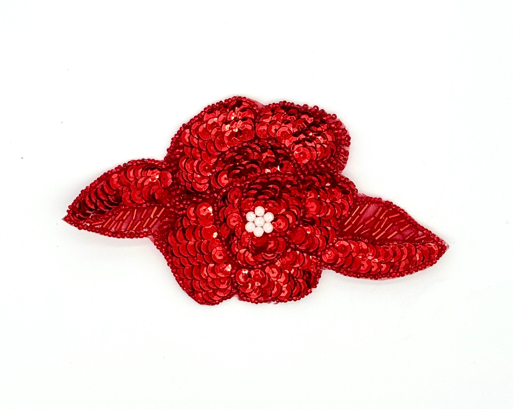Red sequin flower patch on a white background