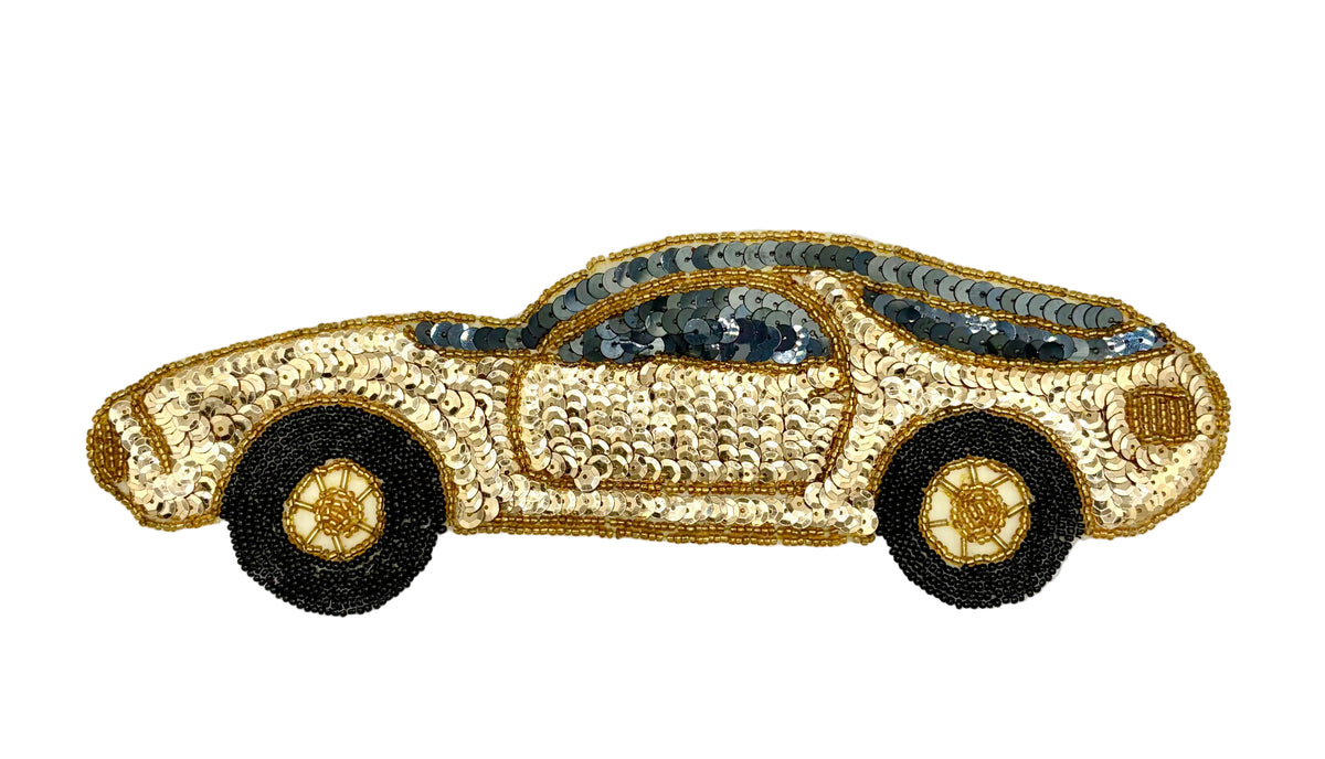 A sequined sports car patch on a plain white background. The patch features a gold sequin body with black wheels and gold hubcaps.