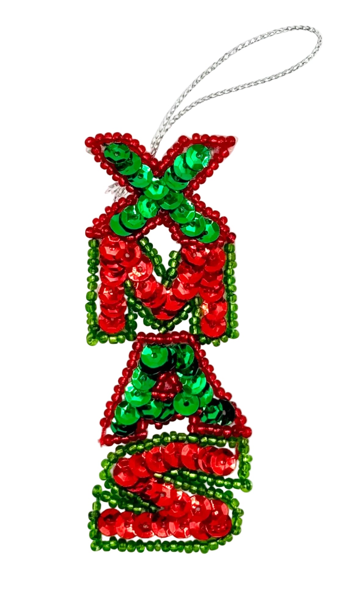 A Christmas ornament shaped like the letters 'XMAS' in a stacked, festive design, covered in red and green sequins with a silver hanging loop at the top, shown on a plain white background.