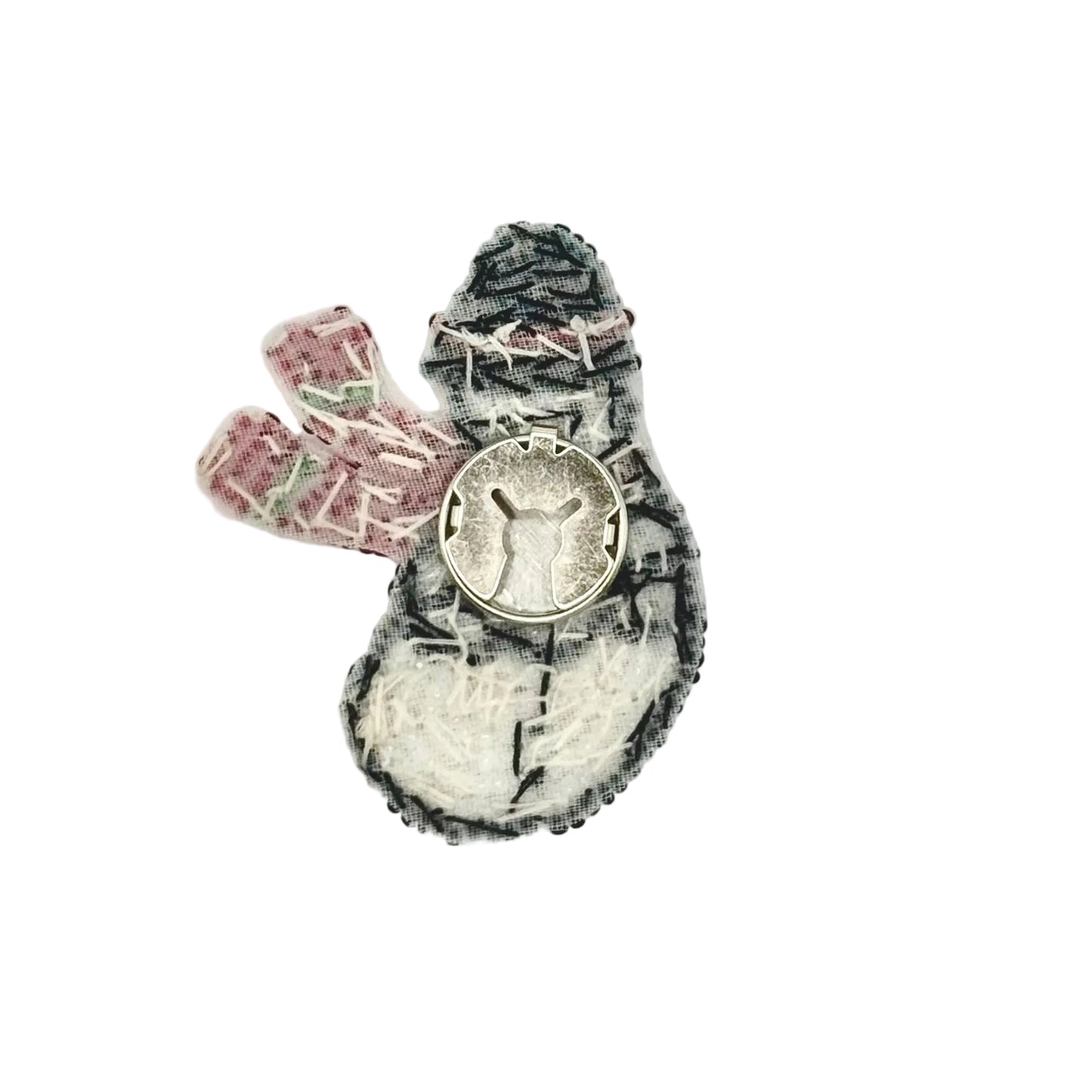 The back of A handmade snowman patch or applique showing the removable button attachment.