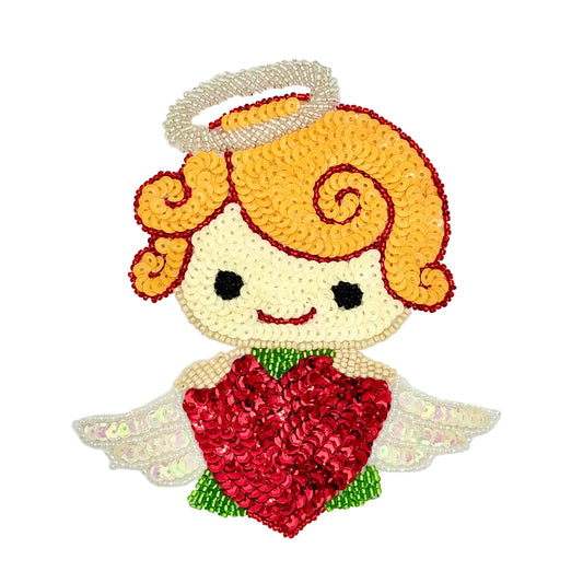 A cute sequin and bead cartoon angel patch with curly orange hair, a white halo, black eyes, a red smile, green dress, and a large red sequined heart on a plain white background.