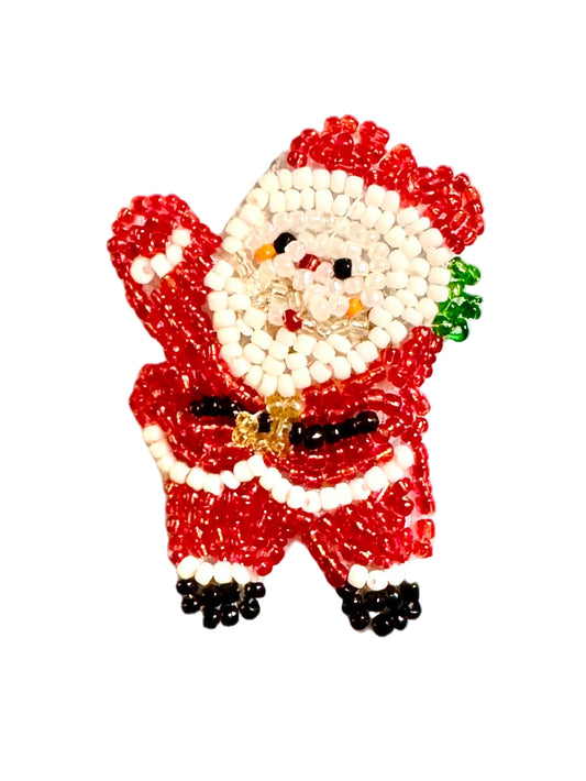 A beaded Christmas Santa Claus figure crafted from red, white, black, and small green glass beads, isolated on a white background.