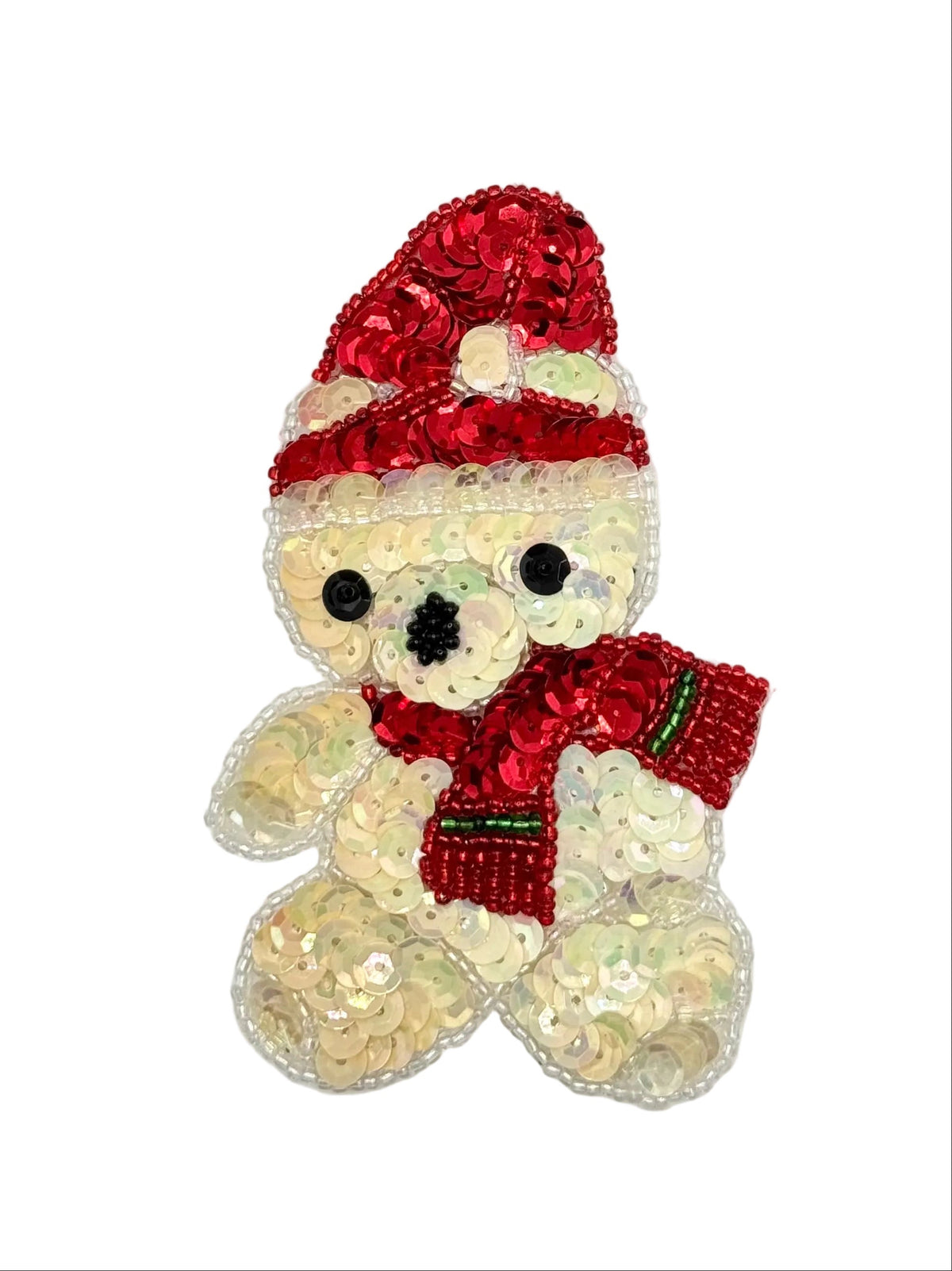 A teddy bear-shaped sequin embellishment featuring a red sequin Santa hat and matching red sequin scarf with small green accents, on a plain white background.