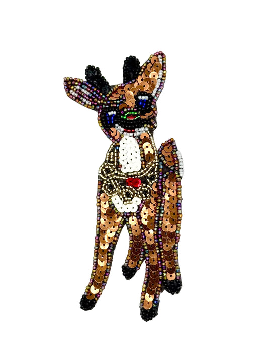 A beaded and sequined reindeer patch on a solid white background.