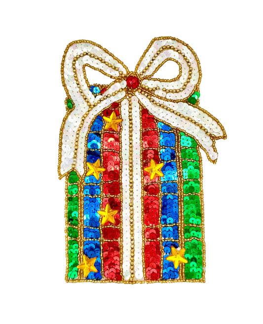 A Christmas gift box sequin patch with a white bow, red, blue, and green striped body, and gold star accents on a white background.