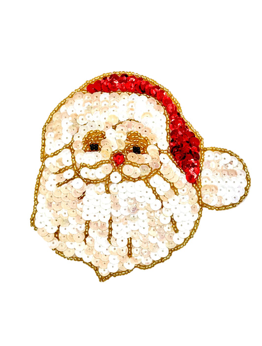 A sequined Santa Claus face patch with a white beard and hat, outlined in gold, on a plain white background.