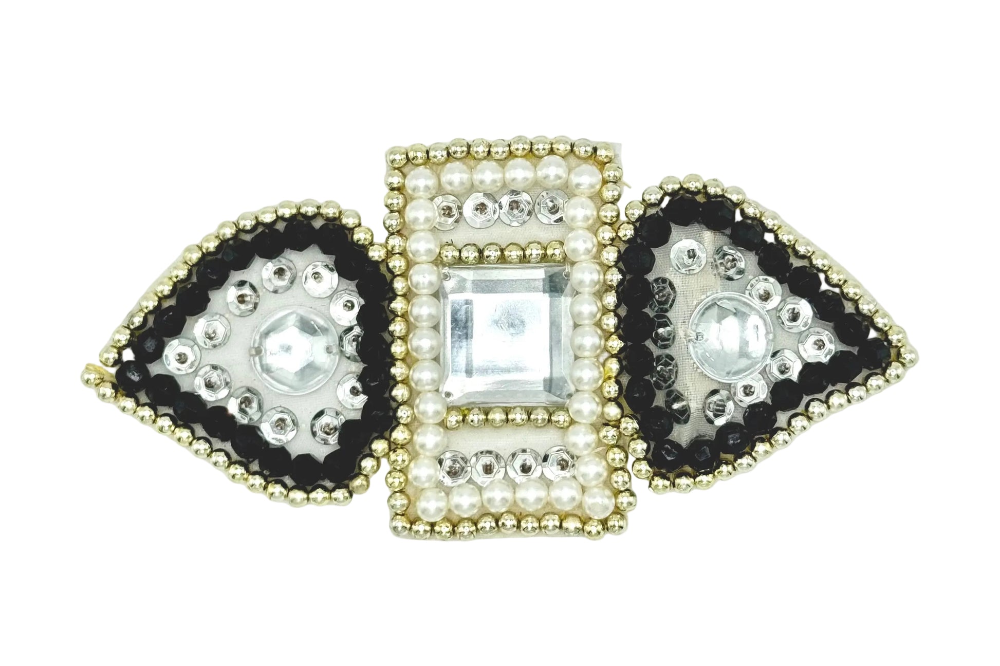 A decorative sequin and bead piece featuring a central square clear crystal surrounded by white faux pearls and gold beads, flanked by two mirrored teardrop-shaped sections with black beads, white pearls, and clear rhinestones on a white background.