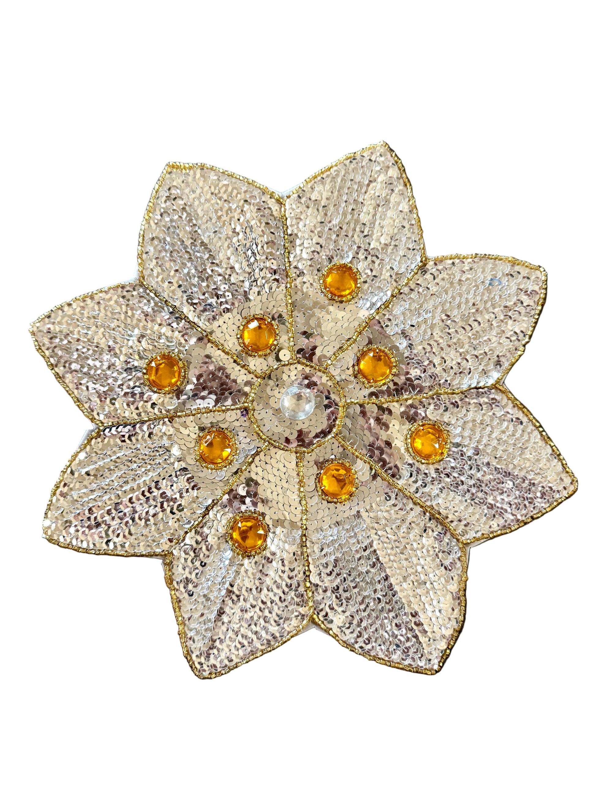 An 1950s-style floral sequin appliqué  with textured silver sequins and gold beads, featuring amber-colored rhinestones around a central clear stone, shown on a white background.