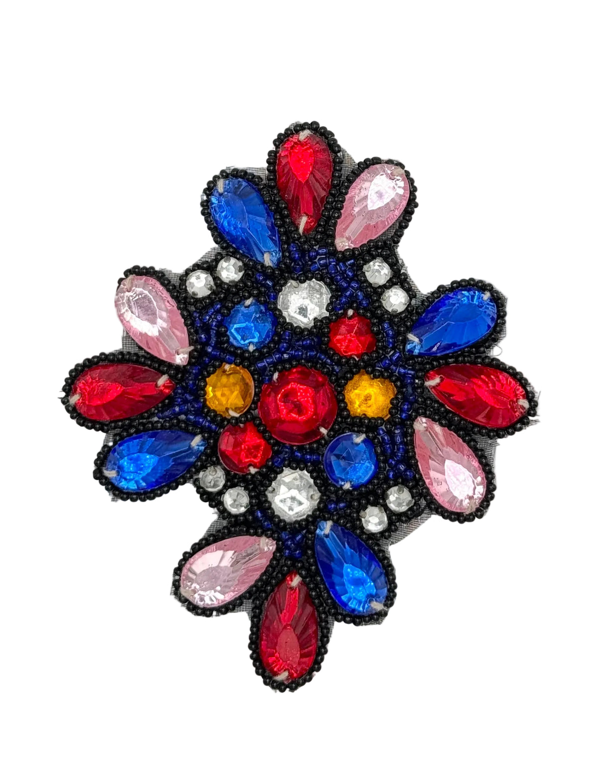 A circular beaded patch featuring a floral or snowflake-like design with red, blue, pink, yellow, and clear rhinestones, outlined in black beads, on a white background.