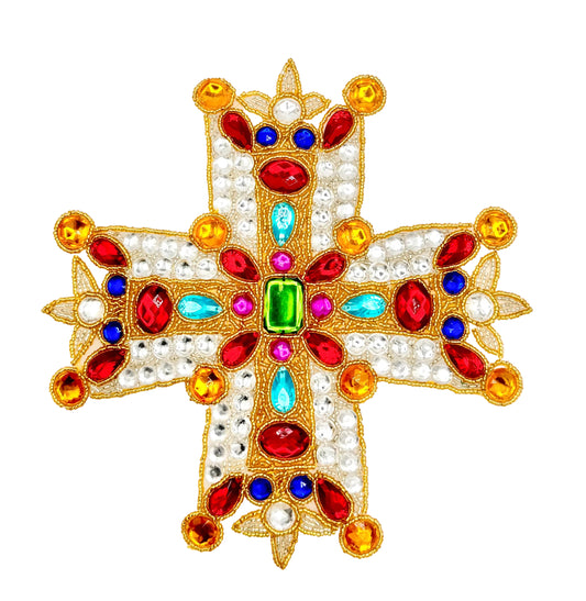 A decorative beaded cross patch with a gold-tone embroidered border, adorned with faux pearls, red, blue, light blue, green, and pink rhinestones, and gold-tone beads, shown on a plain white background.