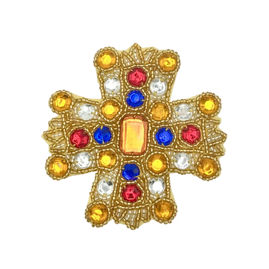 A gold-toned beaded cross embellishment decorated with red, blue, yellow, and clear rhinestones, shown on a plain white background.