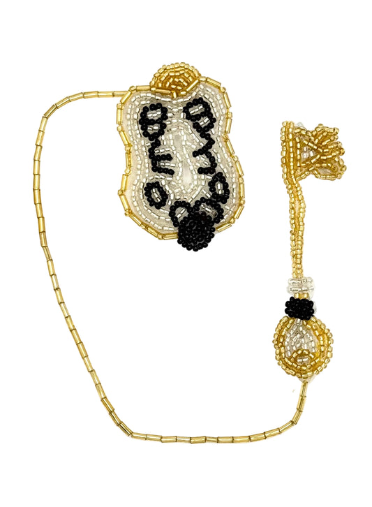 A gold beaded  patch with a decorative lock and a matching beaded key, displayed on a clean white background.