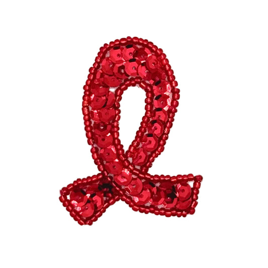 A red sequin awareness ribbon patch on a plain white background.
