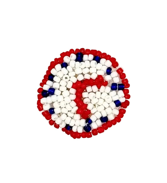 A circular beaded clock patch featuring a patriotic red, white, and blue design, photographed on a plain white background.