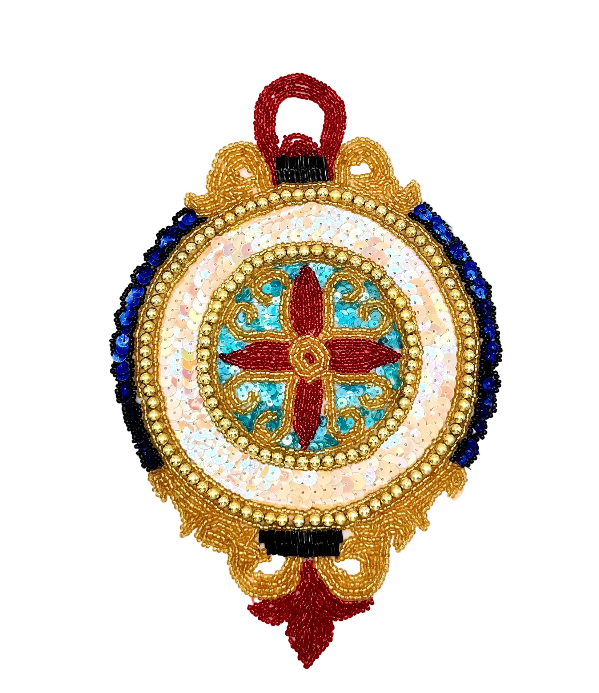A circular, ornate embroidered patch or decorative applique featuring a central red cross motif surrounded by gold, white, blue, and red beadwork on a plain white background.