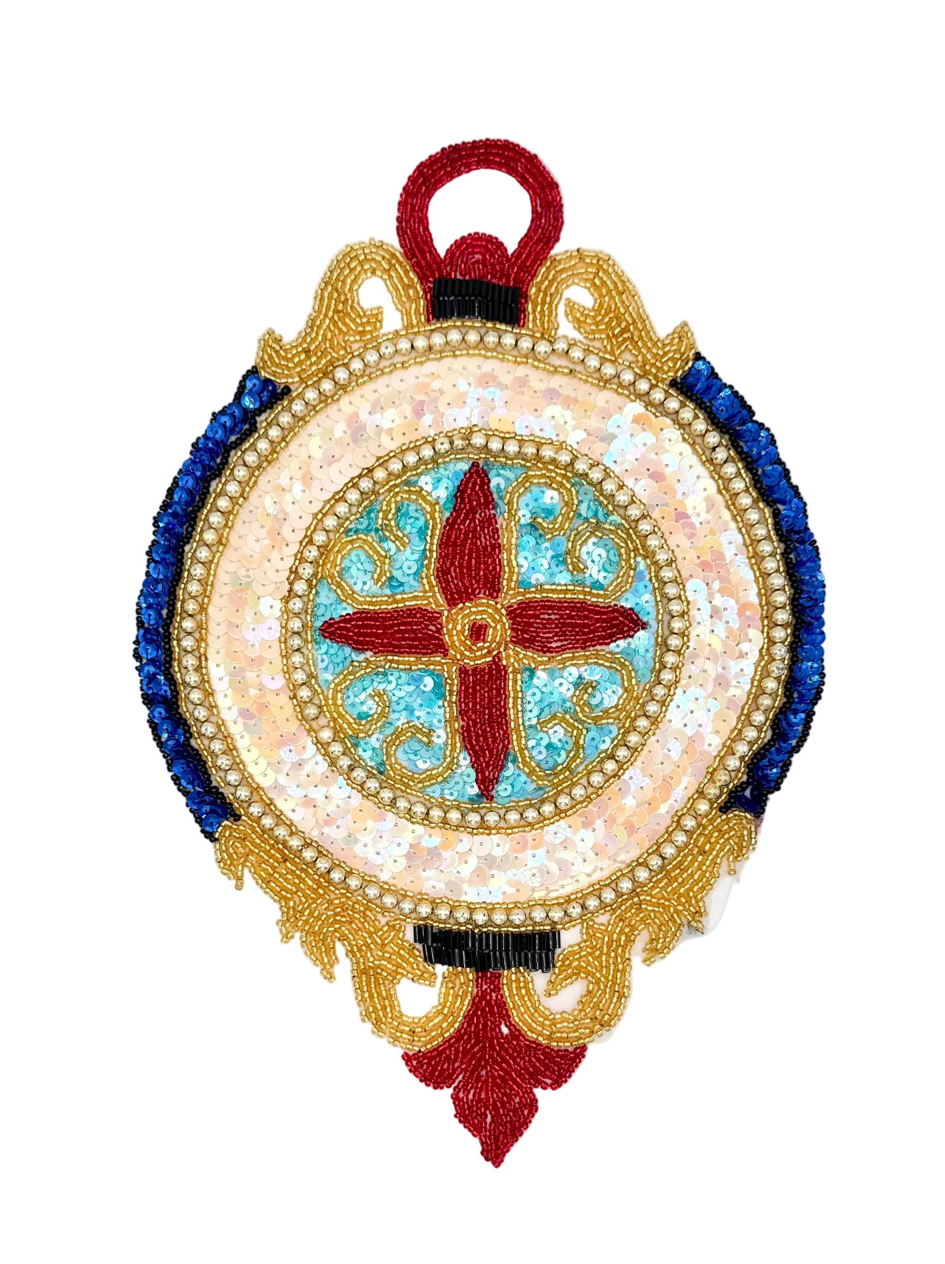 An ornate circular sequin  patch or ornament featuring a central red cross motif over a light blue and white iridescent background, surrounded by gold and blue beaded borders on a white studio background.