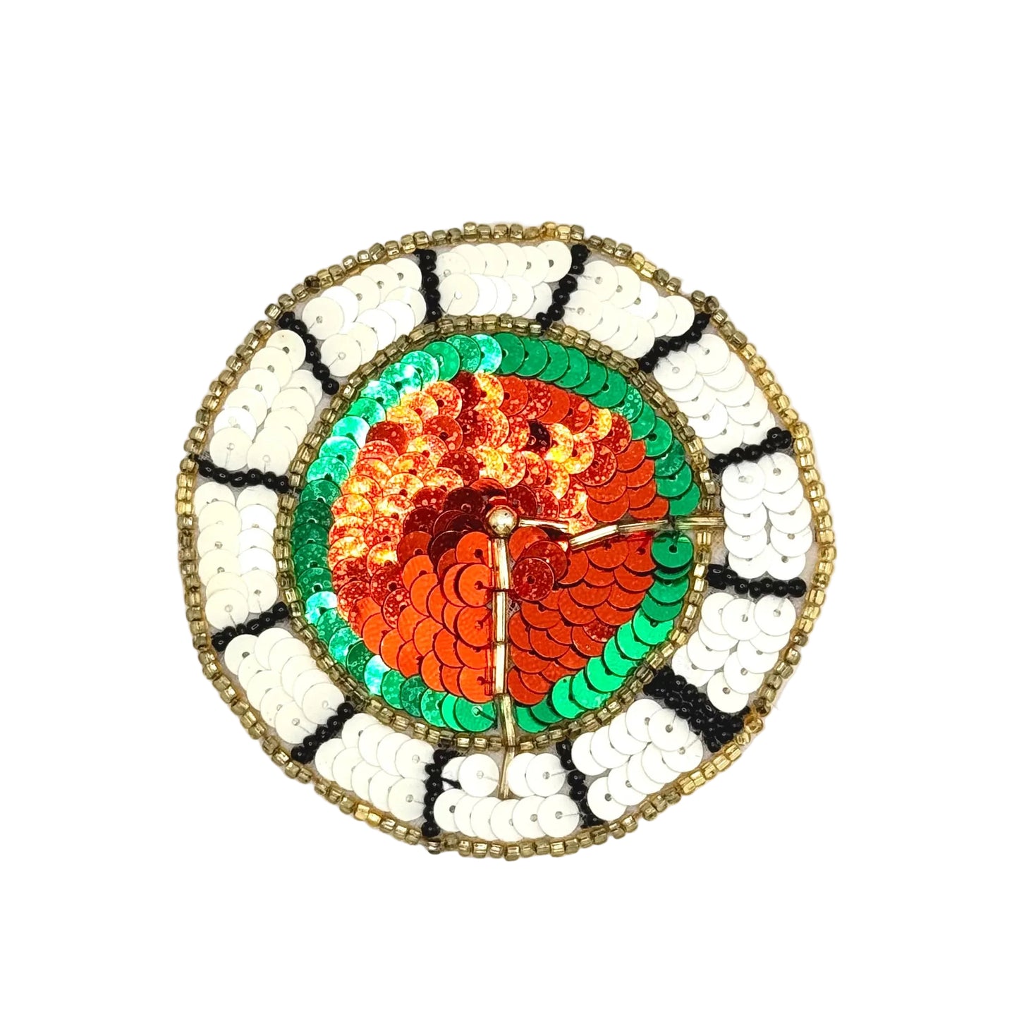 A circular sequined wall clock with a colorful design. The center features red orange sequins, surrounded by green sequins, and the outer ring has white, black, and gold sequins.