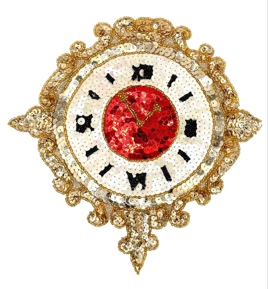 An ornate sequined wall clock with a gold filigree frame, a white face with black Roman numerals, and a vibrant red sequined center.