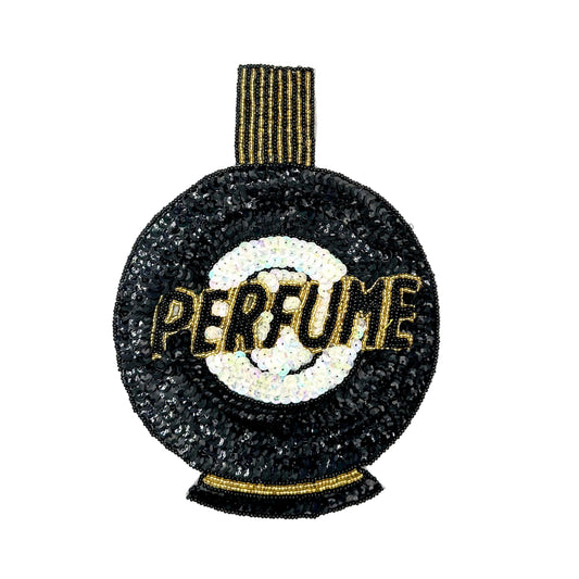 An sequin patch shaped like a perfume bottle, featuring a black sequin body, a white circular center, gold beaded lettering that reads 'PERFUME', and a gold-and-black striped neck, shown on a plain white background.