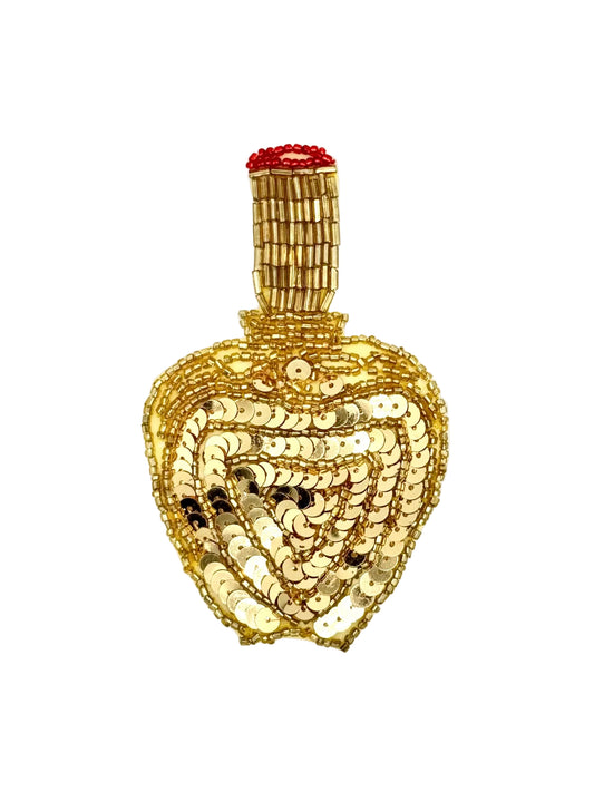 Sequin and bead perfume bottle appliqué with Gold Sequins and red and gold glass beads on a white background.