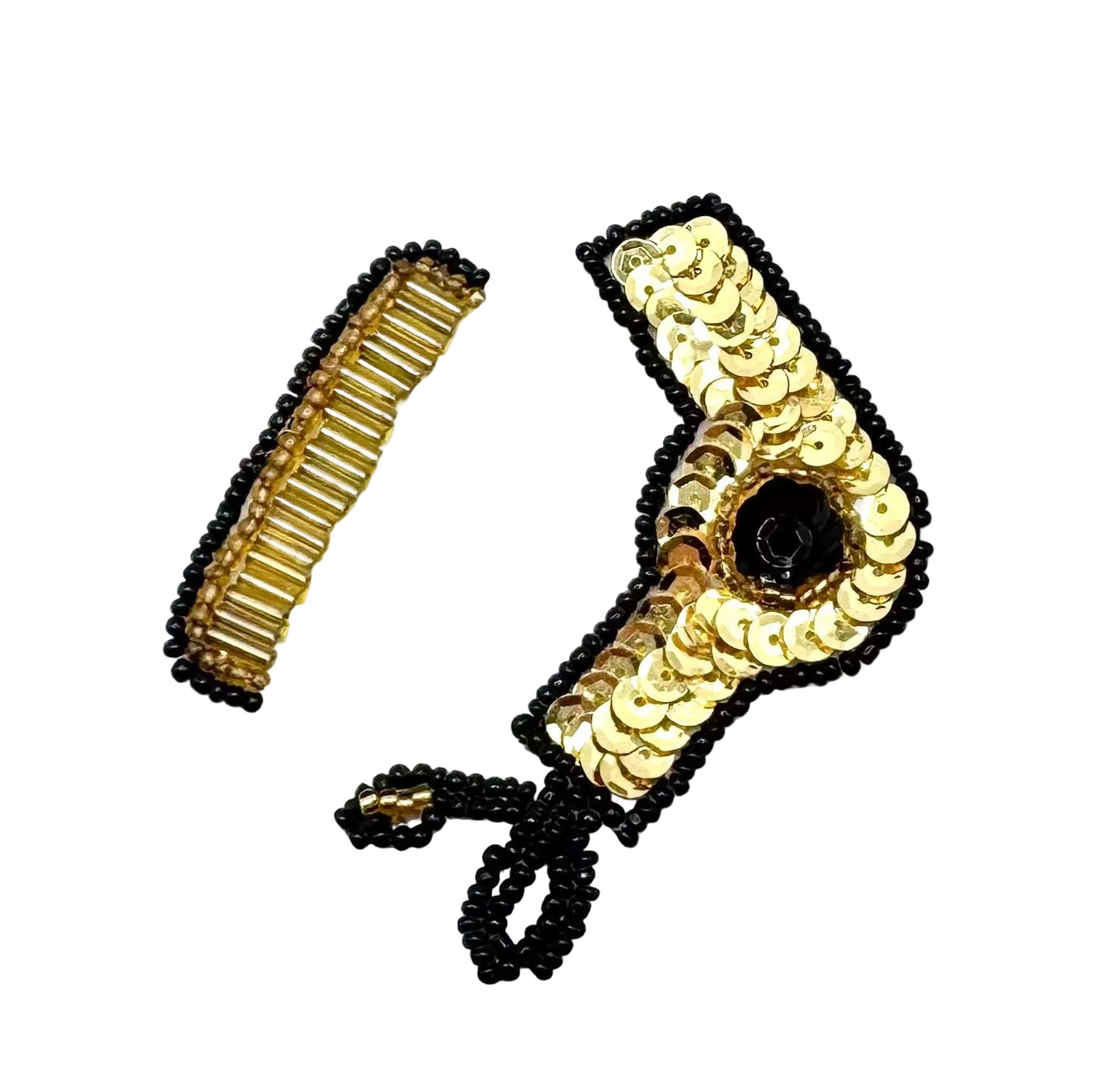 A set of gold and black beaded hair accessories on a plain white background, including beaded comb, beaded scissors and a sequin and bead blow dryer.