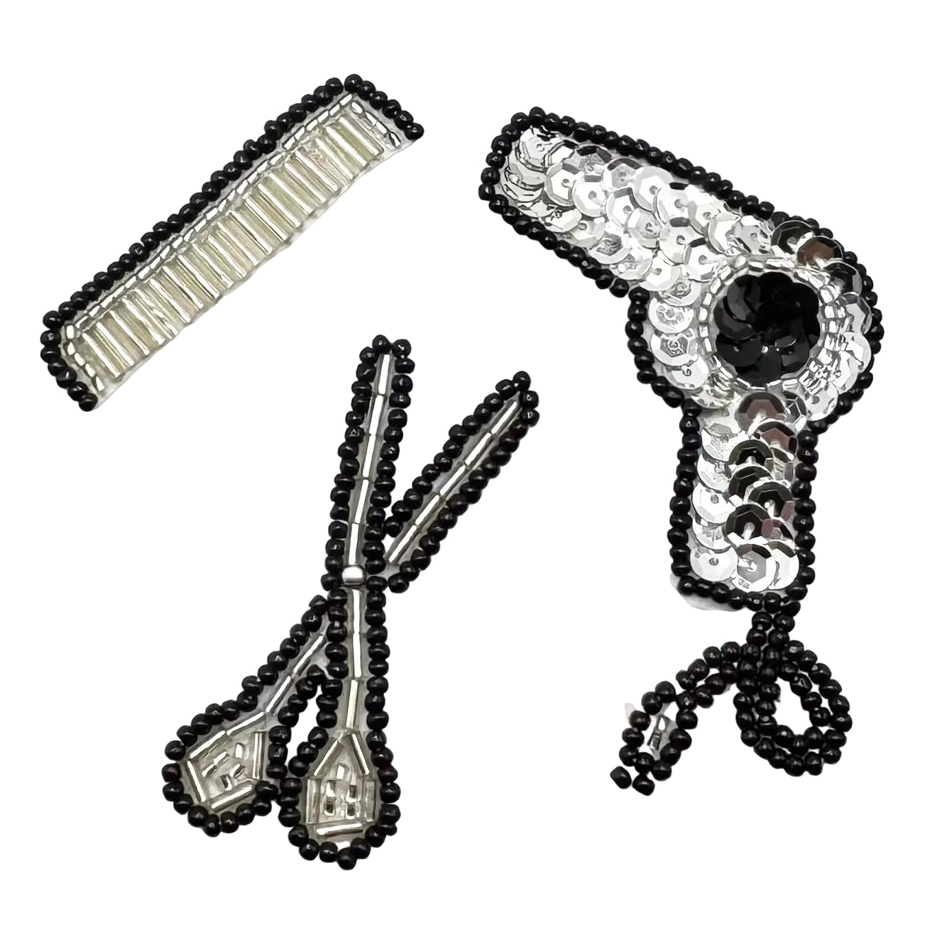 A set of black and silver beaded hair accessories on a plain white background, including beaded comb, beaded scissors and a sequin and bead blow dryer.