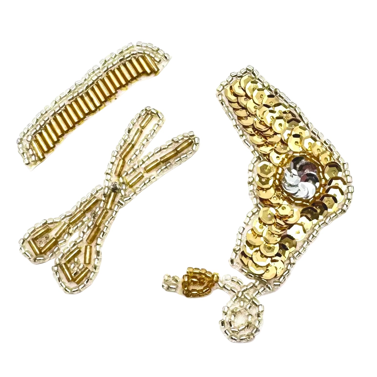 A set of gold and silver beaded hair accessories on a plain white background, including beaded comb, beaded scissors and a sequin and bead blow dryer.
