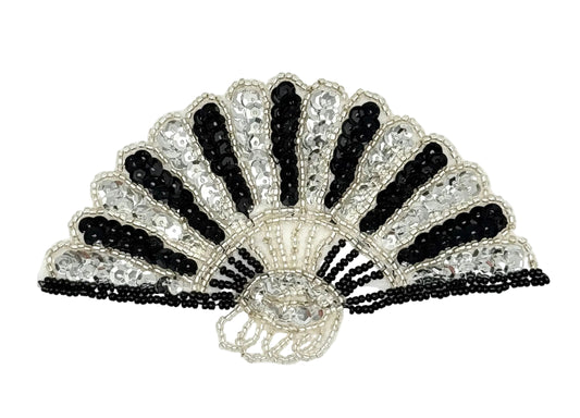 A sequin and bead fan appliqué featuring black and silver beads, sequins, and fringe details on a white background.