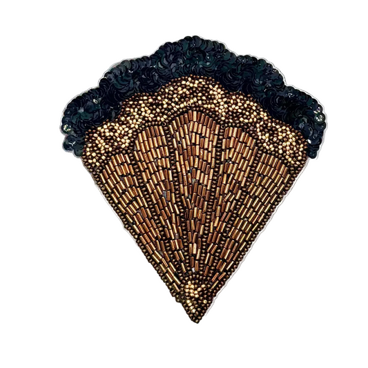 A large, elaborate scallop-shaped embellished , featuring intricate beadwork in shades of gold, bronze, and brown, with a dark teal sequined ruffled trim along the top edge, set against a plain white background
