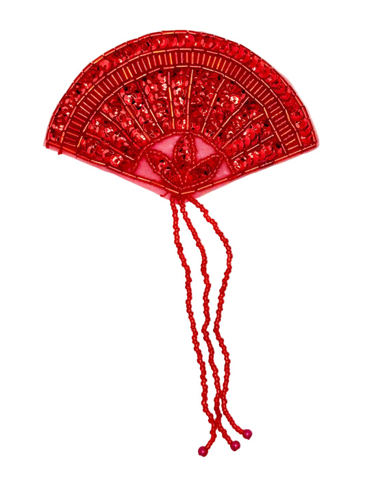 A red sequined fan-shaped decorative embellishment with two long beaded tassels, shown on a plain white background.