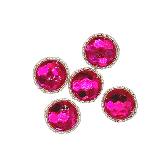 Five round acrylic fuchsia faceted rhinestones with silver beaded borders, arranged on a plain white background.