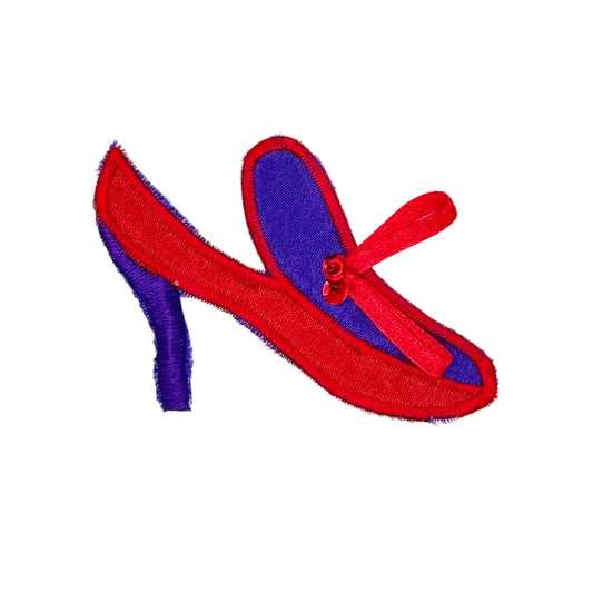 Embroidered red and purple high heeled shoe with red sequin and bead accent on a white backgrounsd.