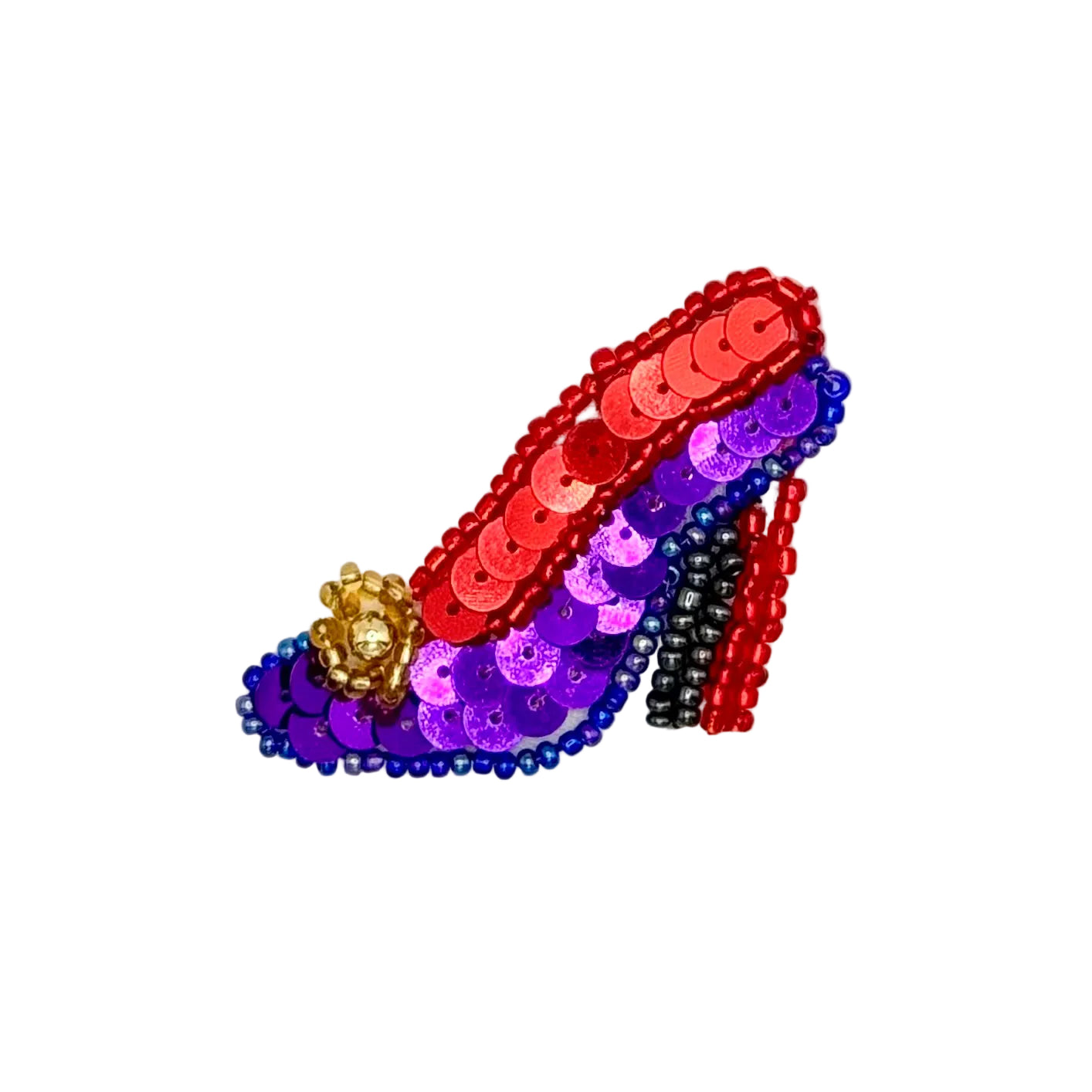 A beaded high-heeled shoe embellishment featuring red and purple sequins, a black and red bead heel column, and a gold crown accent on a plain white background.