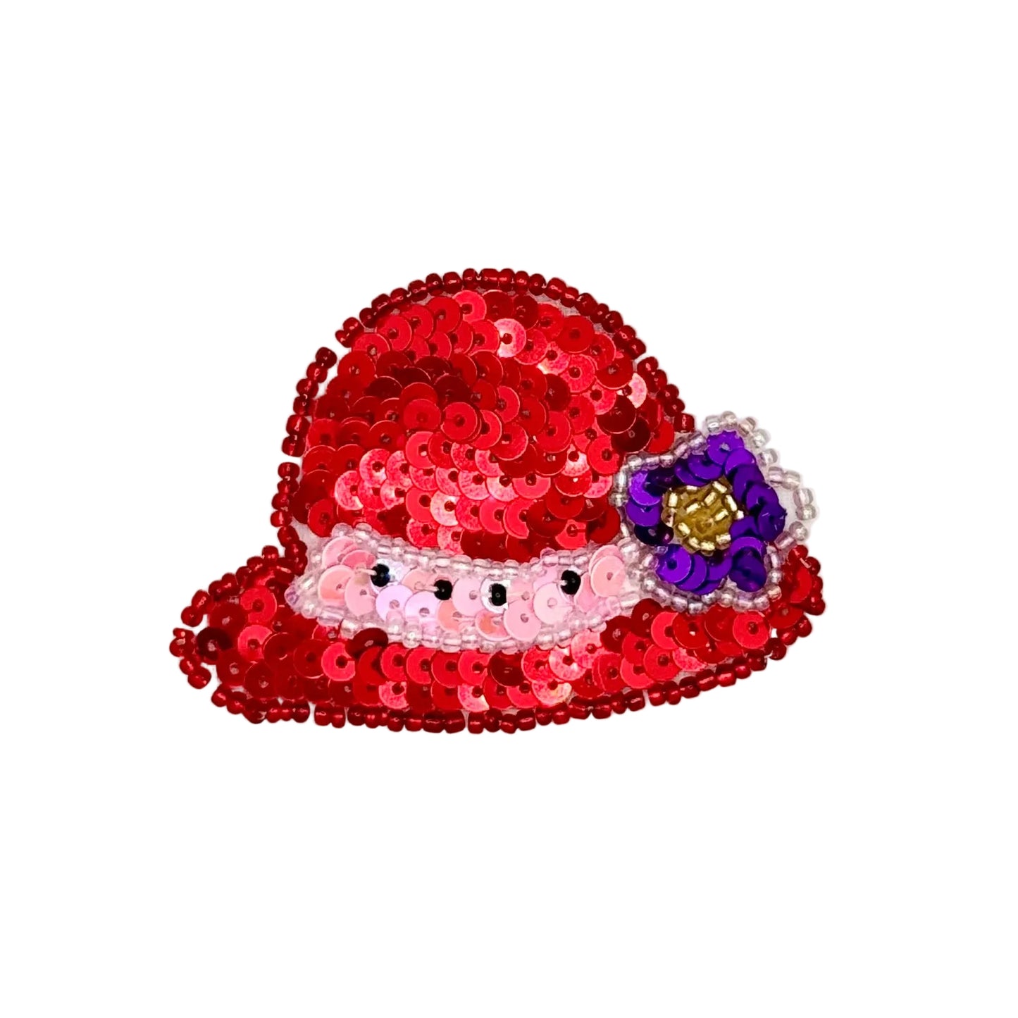 A red sequined hat-shaped applique with a pink sequin band, small black beads, and a purple flower with a gold center on the side, shown on a plain white background.