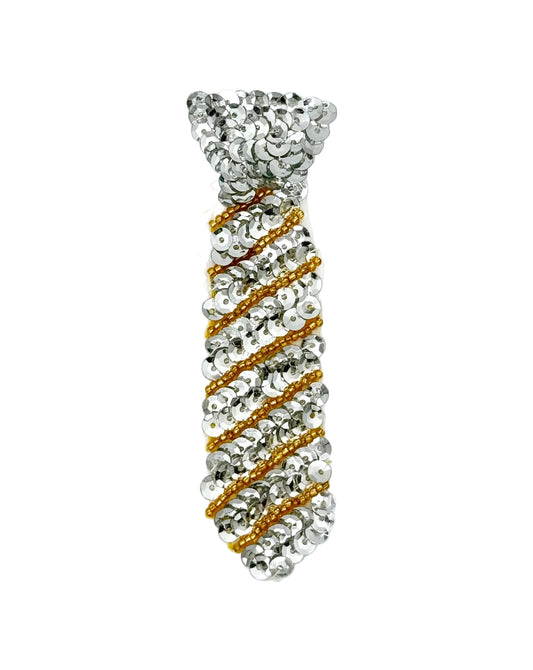 A novelty necktie-shaped accessory covered in silver sequins with diagonal gold beaded stripes, shown on a plain white background.