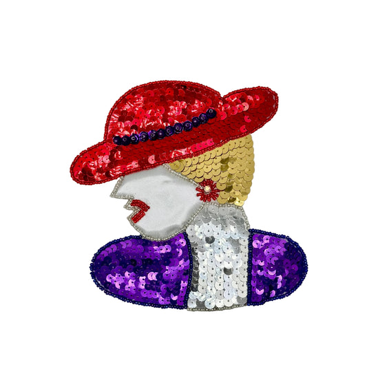 A stylized sequined fashion illustration of a woman in profile wearing a red hat with blue sequin accents, a gold sequin hair section, a silver sequin top, and purple sequin sleeves, on a plain white background.