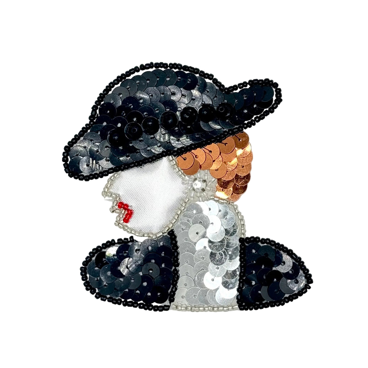 A decorative embroidered patch or applique shaped like a woman in profile, covered with sequins. The hat and outer garments are black and silver sequins, the face and torso are silver, the hair is bronze sequins, and there are red bead accents for the lips.