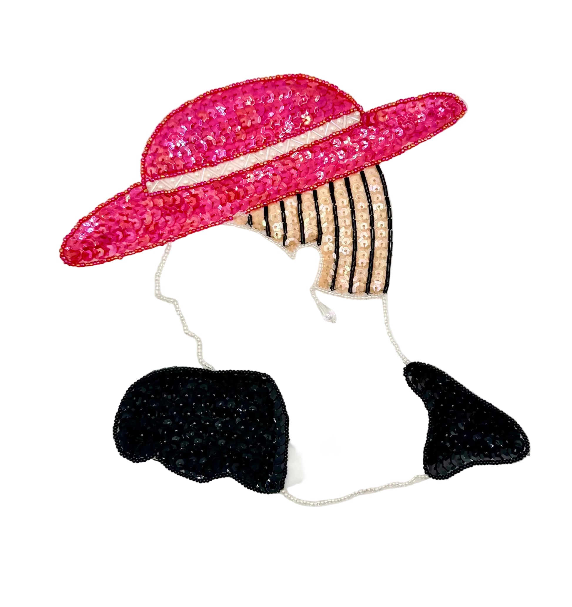 A sequined appliqué patch of a woman's profile wearing a wide-brimmed iridescent red hat, black and gold striped hair, a black dress, shown on a plain white background.