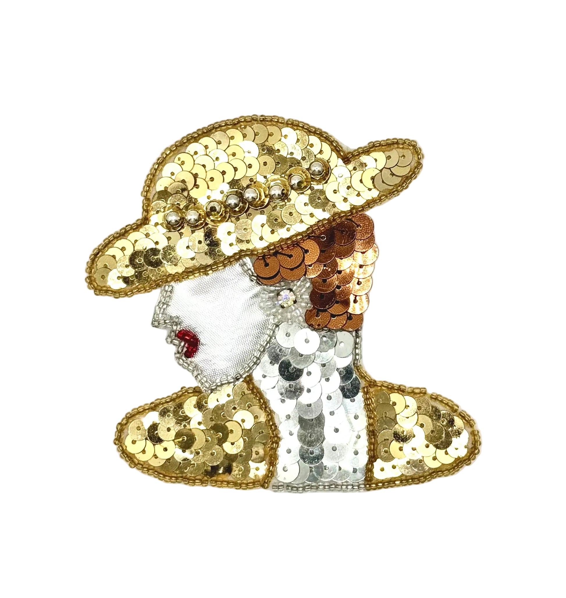 A sequined patch or applique depicting a woman in profile wearing a wide-brimmed hat, with gold, copper, white, and silver sequins on a white background.