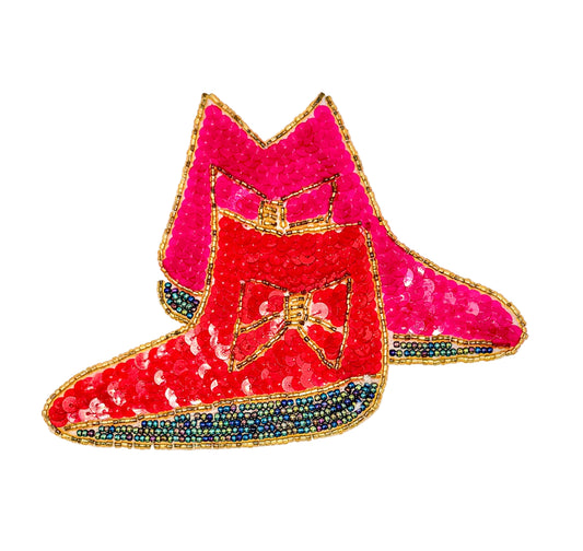 A pair of red and pink sequined boot embellishments with gold trim and blue iridescent beaded trim, shown on a plain white background.