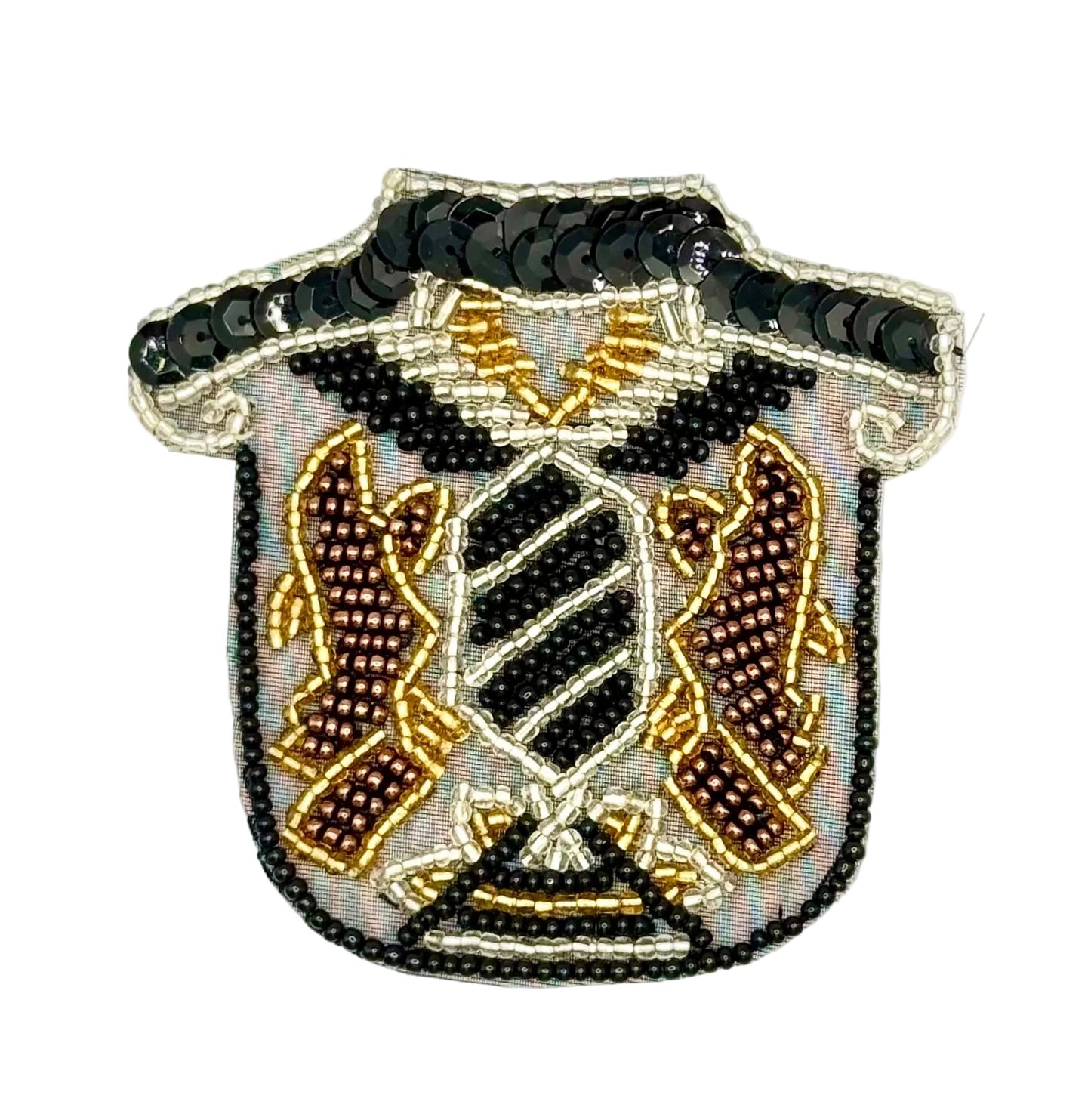 A shield-shaped beaded patch with a black beaded collar and a central crest featuring black, gold, and brown details on a white background.
