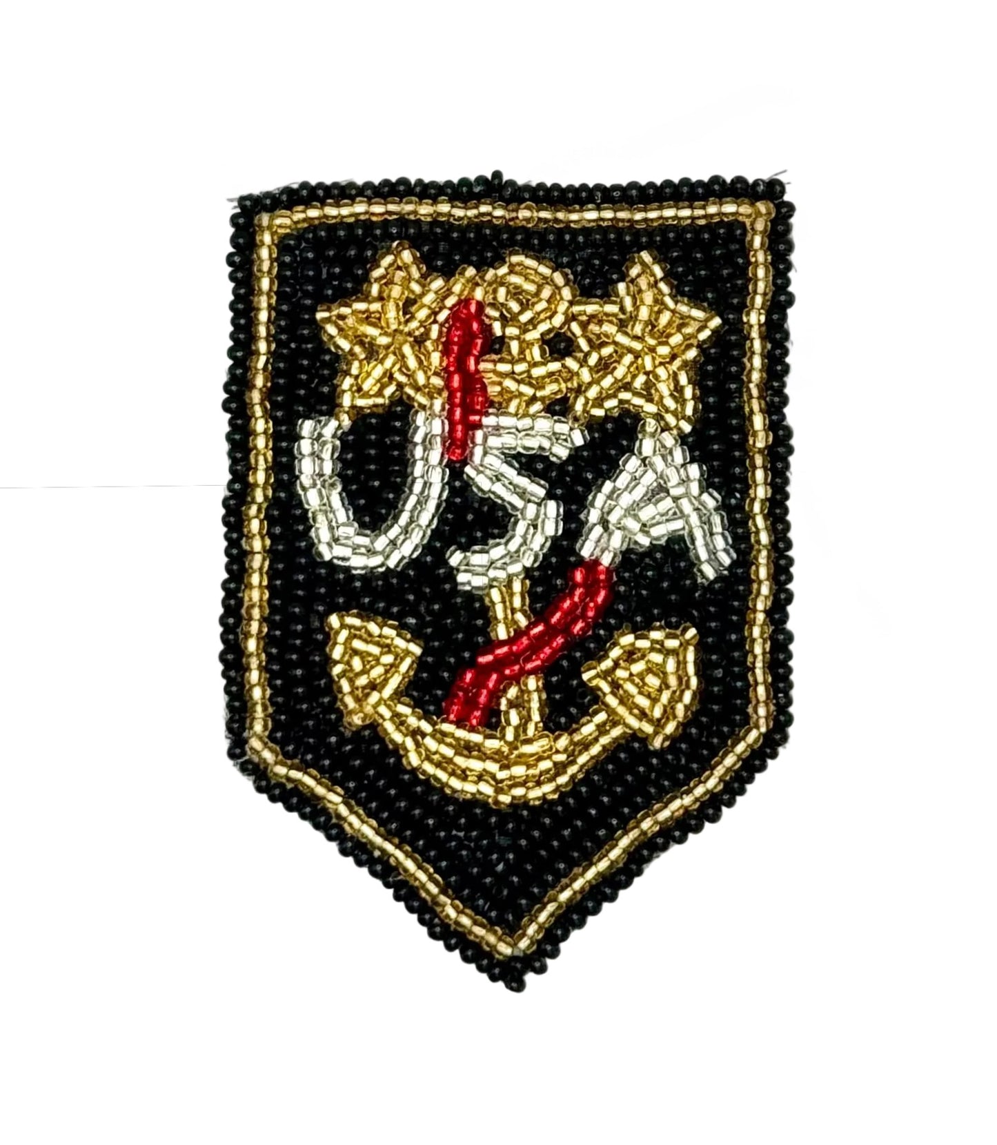 A shield-shaped beaded patch featuring a black background with a gold border, white and gold 'USA' lettering, and a gold anchor with red accents, shown on a plain white background.