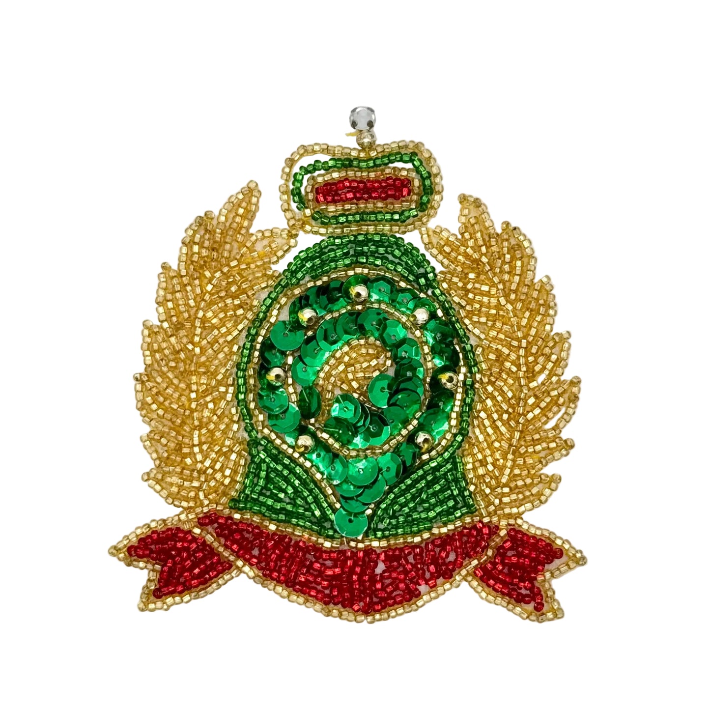 A decorative beaded crest patch featuring a green central oval with a leaf motif, gold leaf-like side panels, a small red and green top crown, and a red ribbon banner at the bottom, shown on a plain white background.