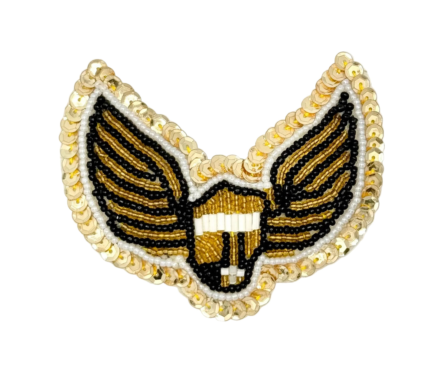 A beaded winged emblem patch featuring a central gold and white shield with black and gold striped wings, bordered by a gold sequined edge, on a plain white background.