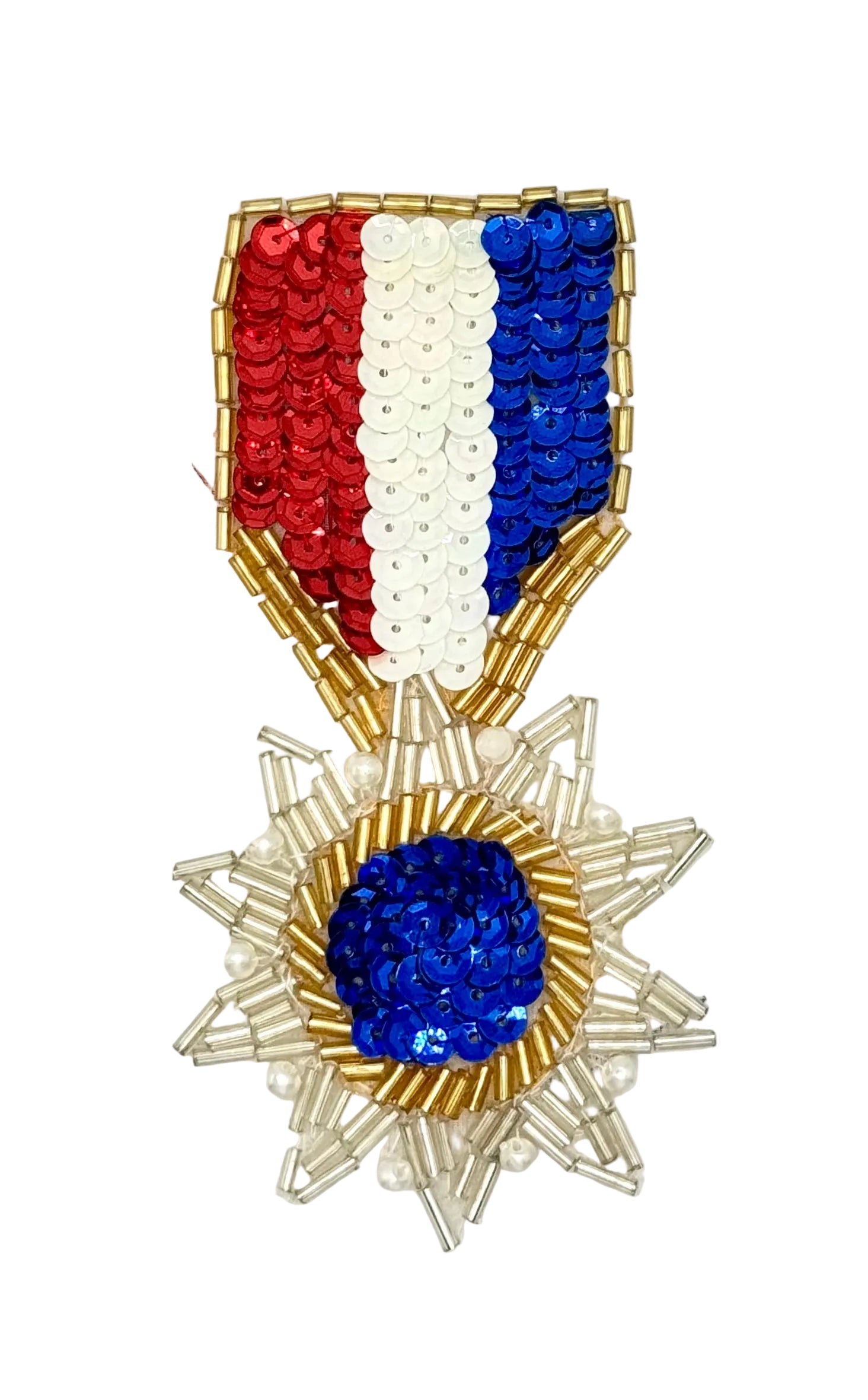 A beaded medal with a red, white, and blue ribbon and a gold and silver starburst medallion on a white background.