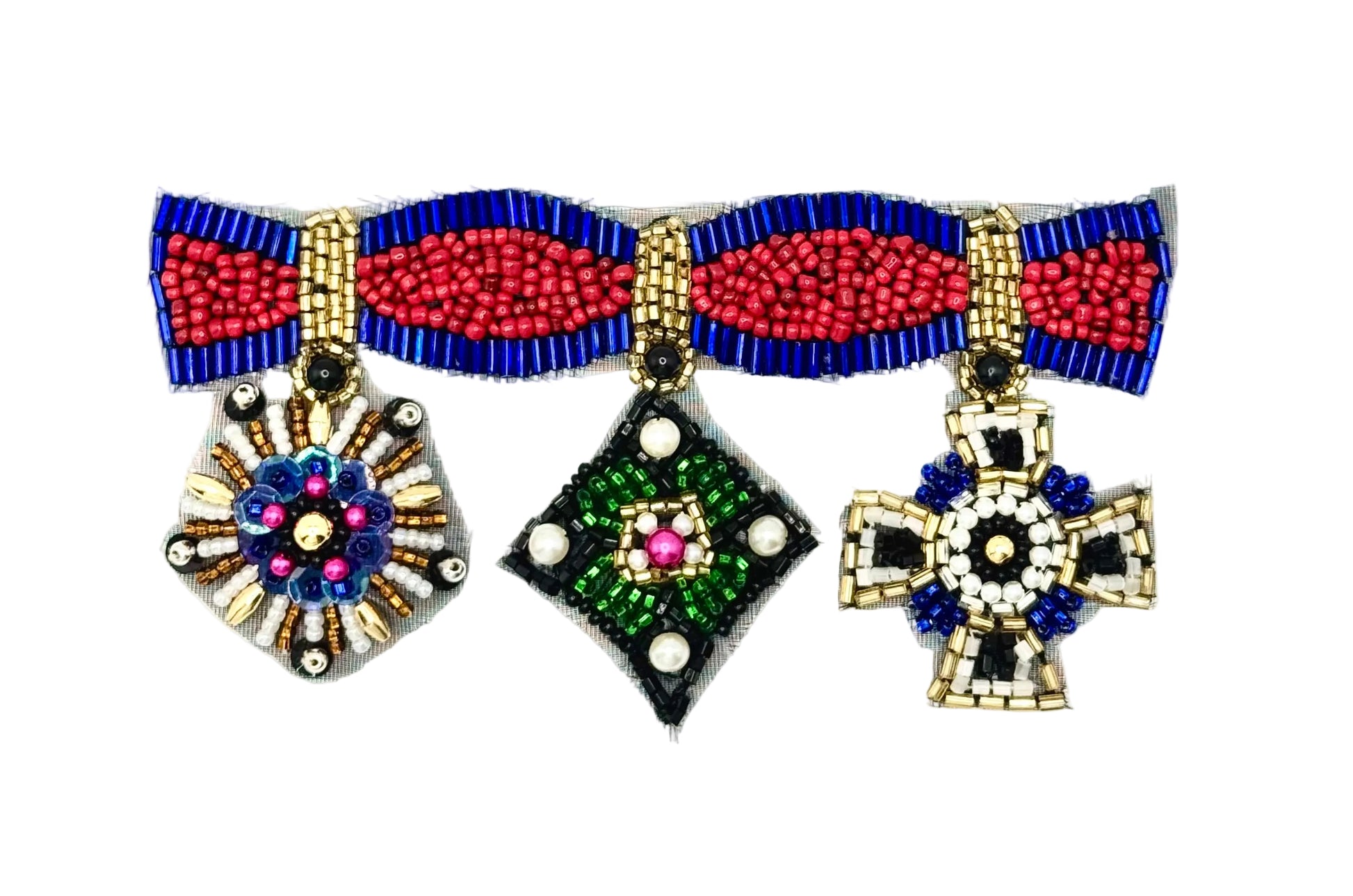 A beaded patch with three medals from a beaded ribbon : a sunburst design with gold, blue, pink, and white beads; a diamond-shaped pendant with green, black, white, and pink beads; and a cross pendant with gold, black, blue, and white beads, all shown on a plain white background.