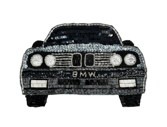 A black and silver beaded and sequin patch of a BMW car front, shown on a white background.