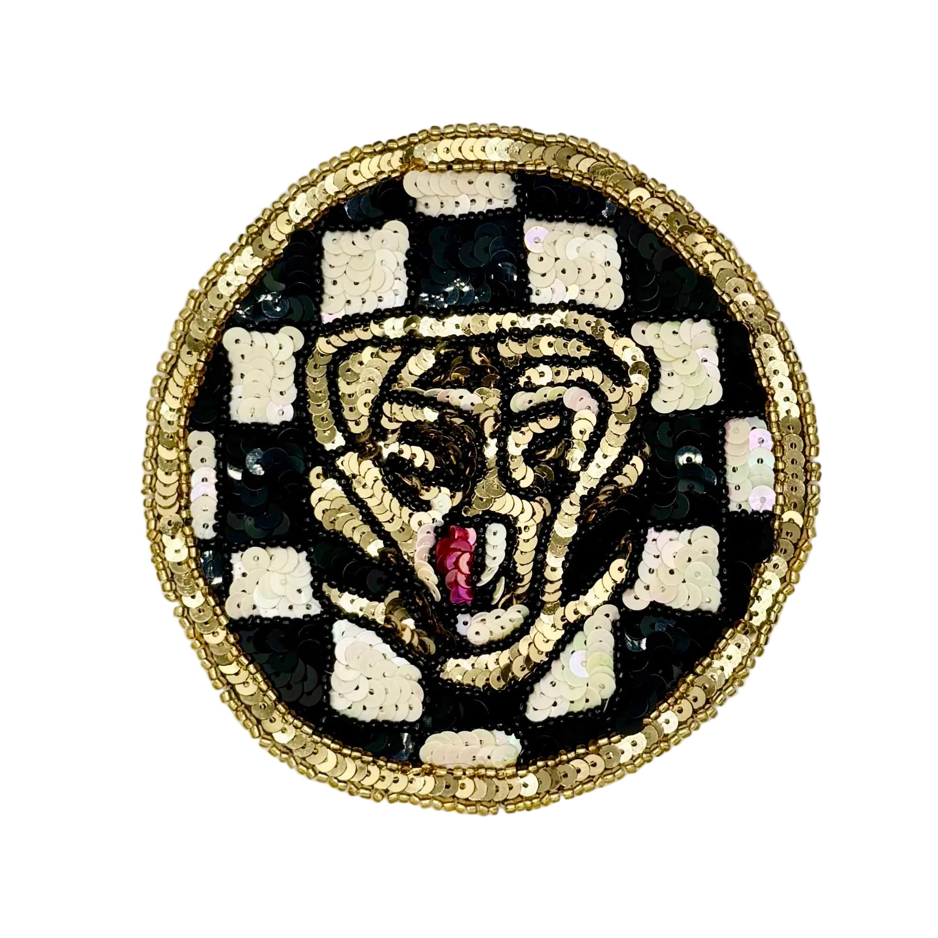 A circular sequined patch featuring a stylized tiger face with a pink tongue, set against a black and white checkered background and finished with a gold braided border.
